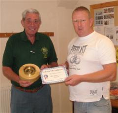 Bert Lanham receives a certificate from Tony
